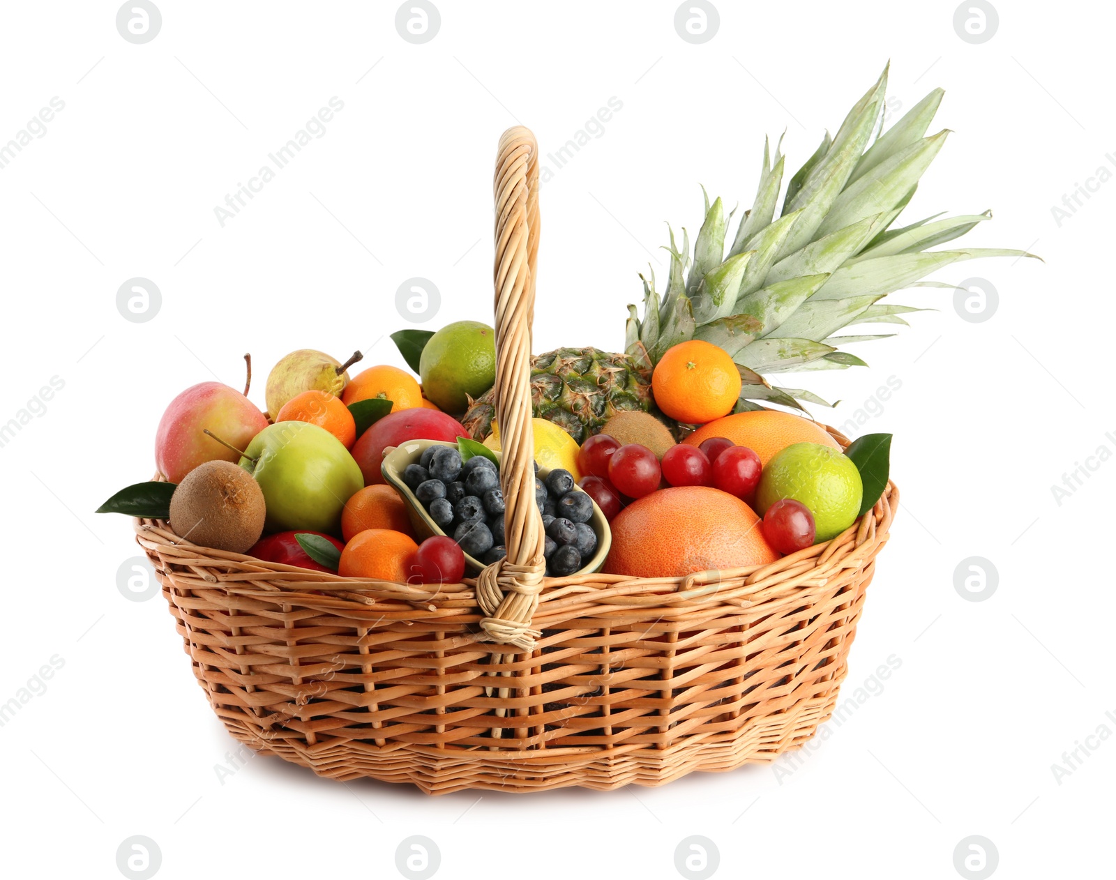 Photo of Assortment of fresh exotic fruits in wicker basket on white background