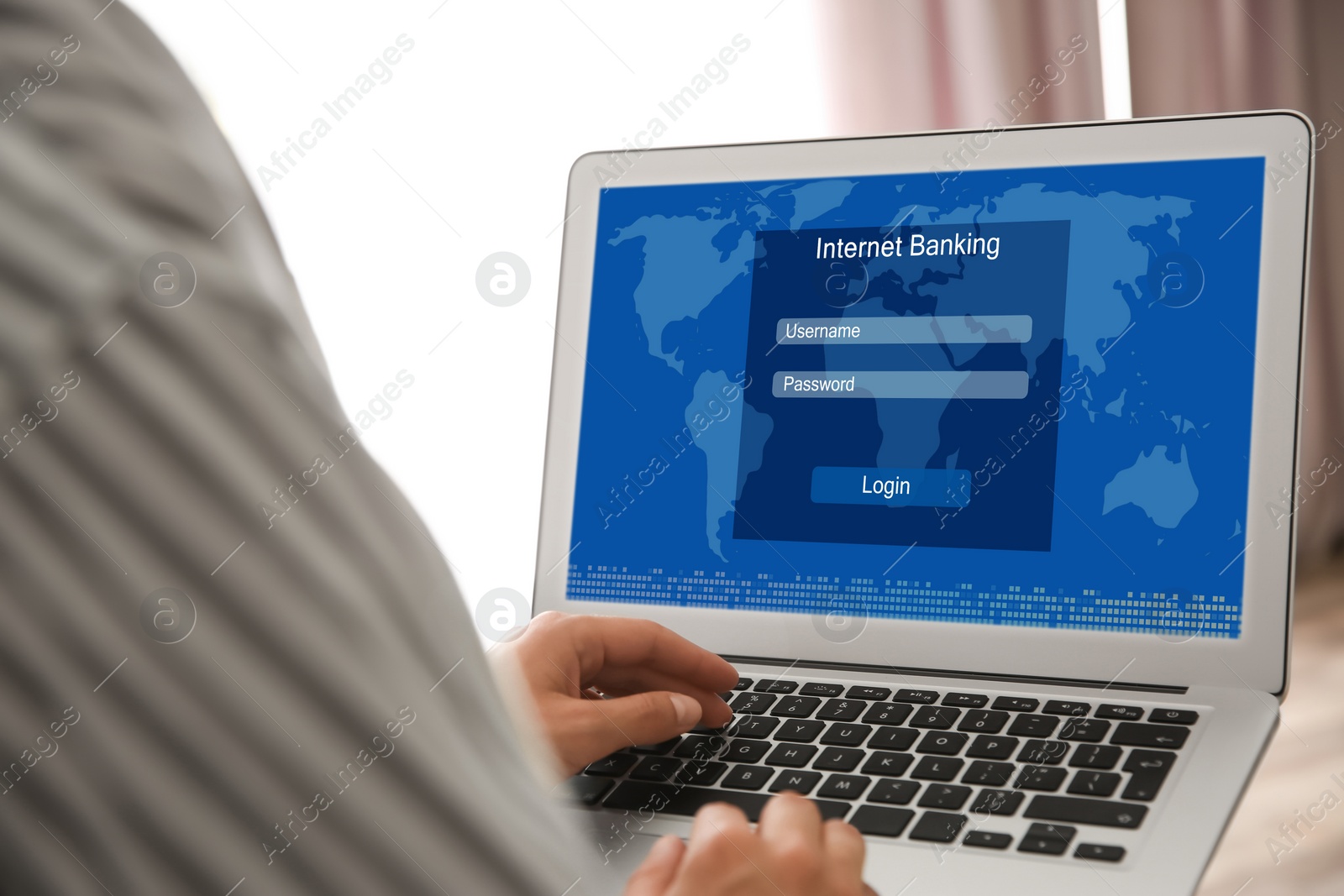 Image of Woman using online banking application on laptop indoors, closeup
