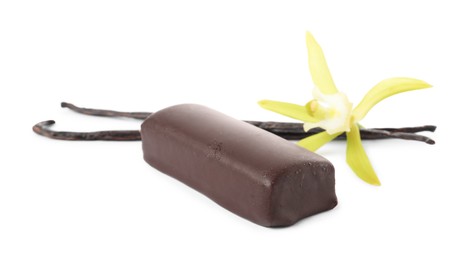 Photo of Glazed curd cheese bar, vanilla pods and flower isolated on white