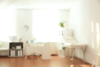 Photo of Blurred view of modern medical office. Doctor's workplace