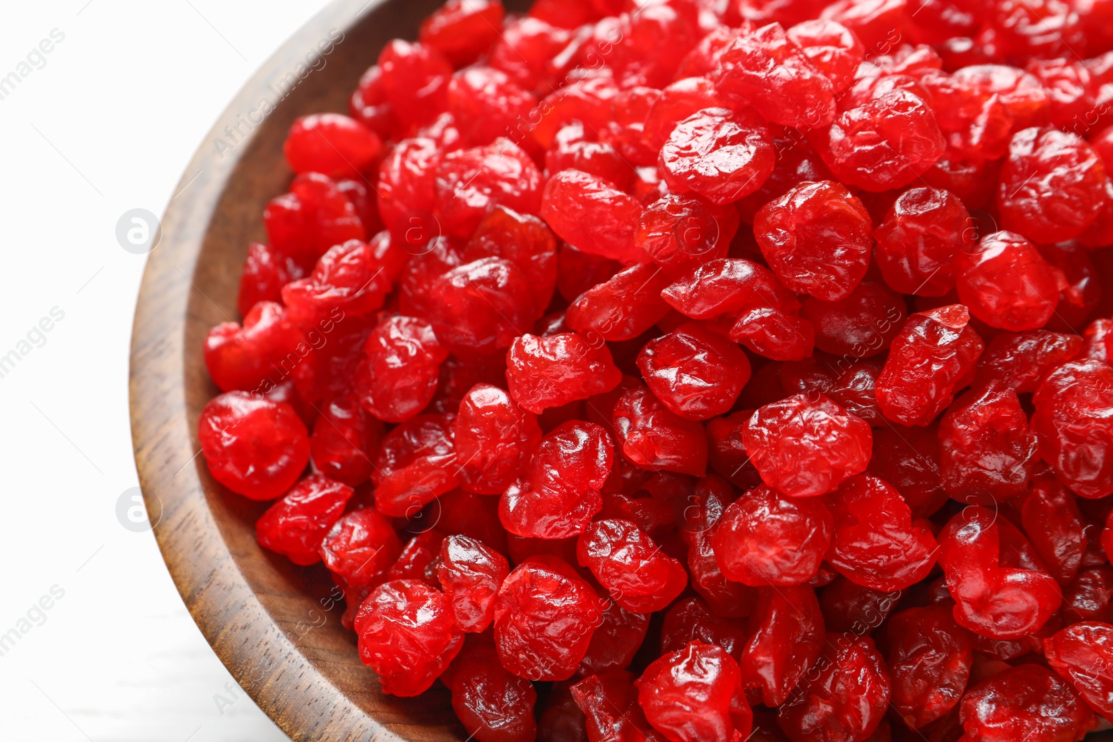 Photo of Bowl with tasty cherries on light background, closeup. Dried fruits as healthy food