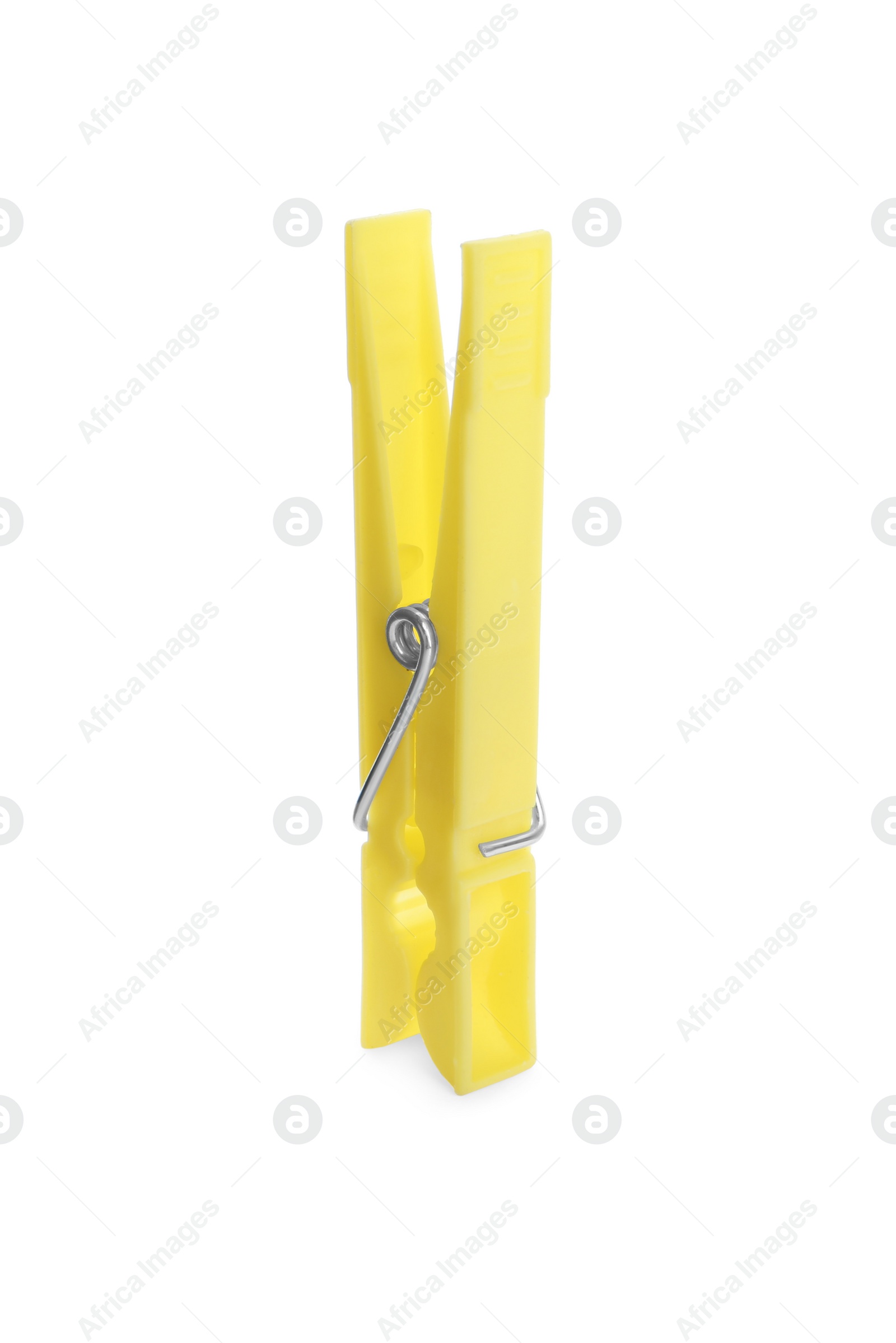 Photo of Bright yellow plastic clothespin isolated on white