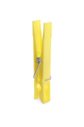 Bright yellow plastic clothespin isolated on white