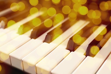 Christmas and New Year music. Piano, closeup. Bokeh effect