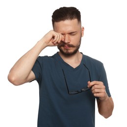 Young man suffering from eyestrain on white background