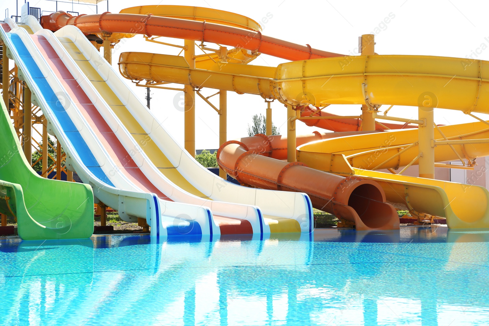 Photo of Different colorful slides in water park on sunny day