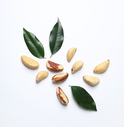 Photo of Composition with Brazil nuts on white background, top view
