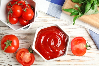 Photo of Composition with tasty homemade tomato sauce on wooden table, flat lay