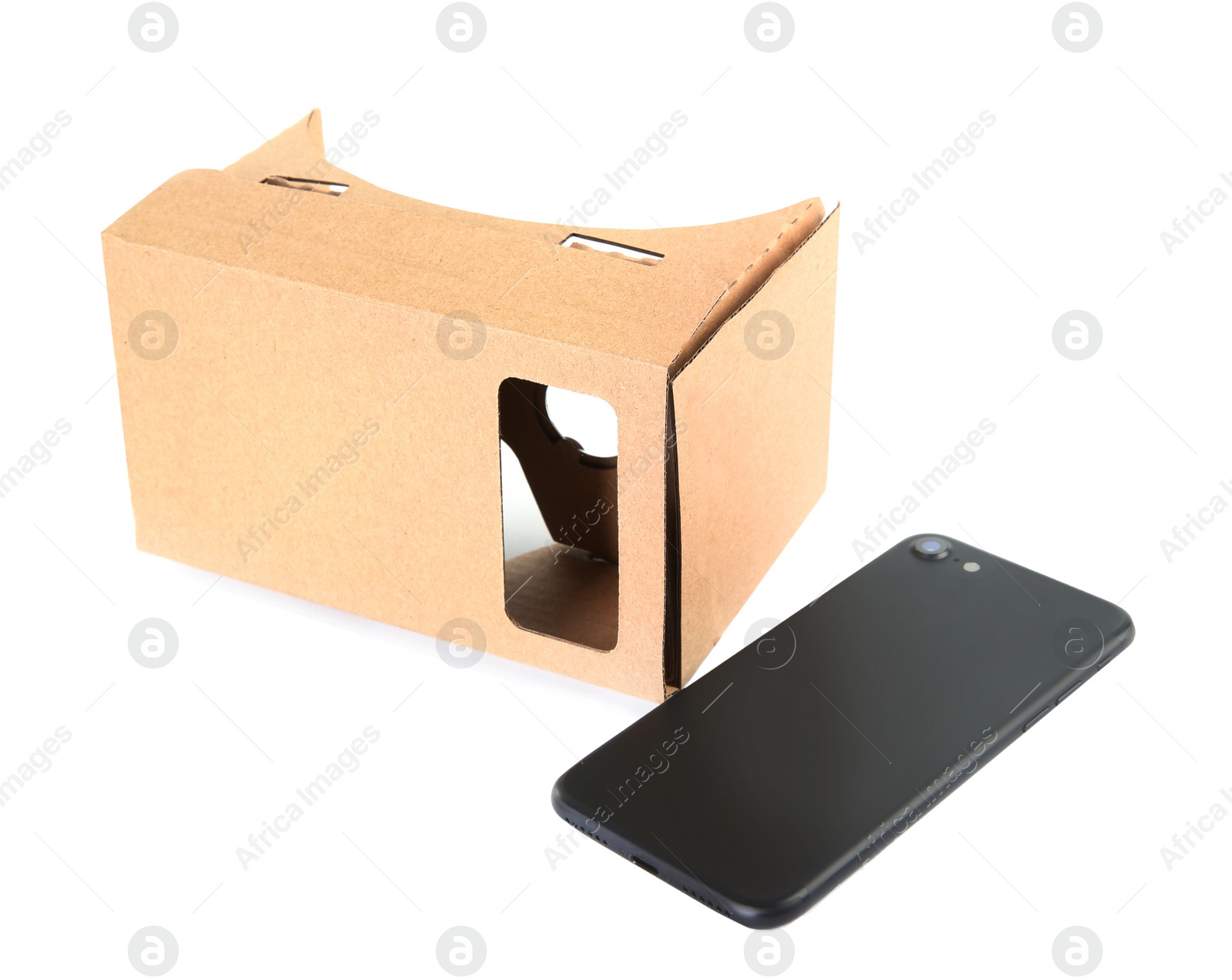 Photo of Cardboard virtual reality headset and smartphone on white background