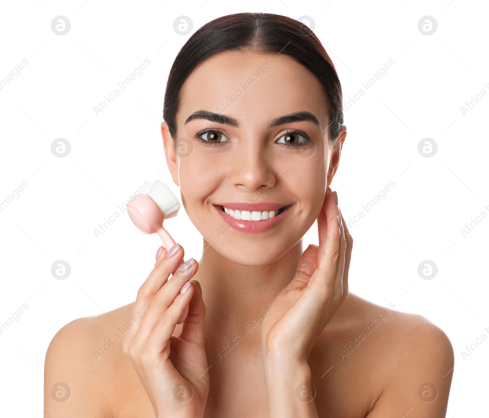Photo of Young woman using facial cleansing brush on white background. Washing accessory