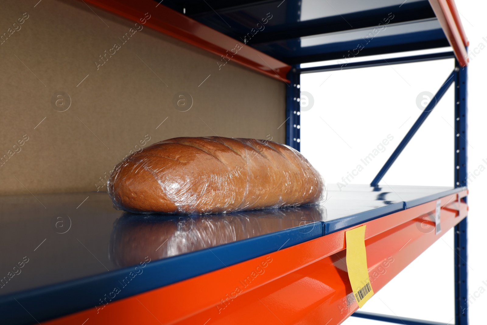 Photo of Loaf of bread on empty shelves against white background. Product deficiency due to social panic