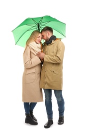 Full length portrait of beautiful couple with umbrella, isolated on white