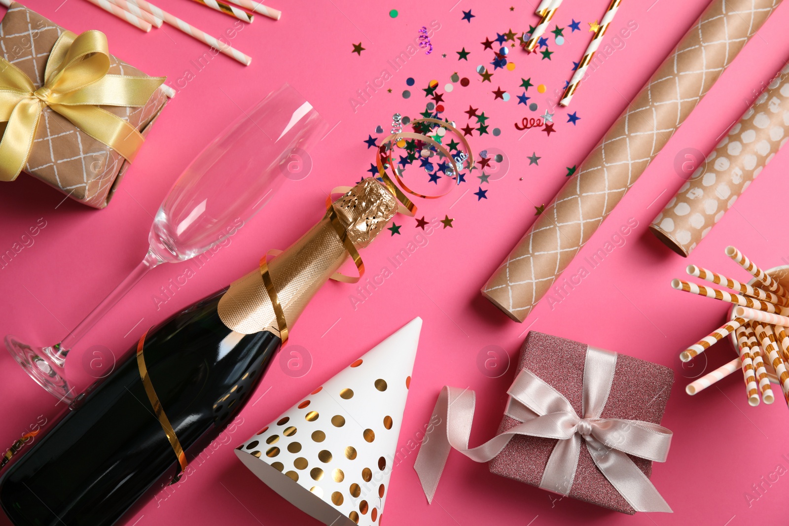 Photo of Creative flat lay composition with bottle of champagne on color background