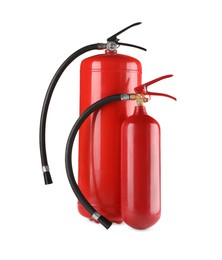 Photo of Two red fire extinguishers on white background