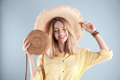 Photo of Beautiful young woman posing on color background. Summer fashion