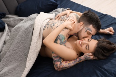 Photo of Passionate young couple having sex on bed