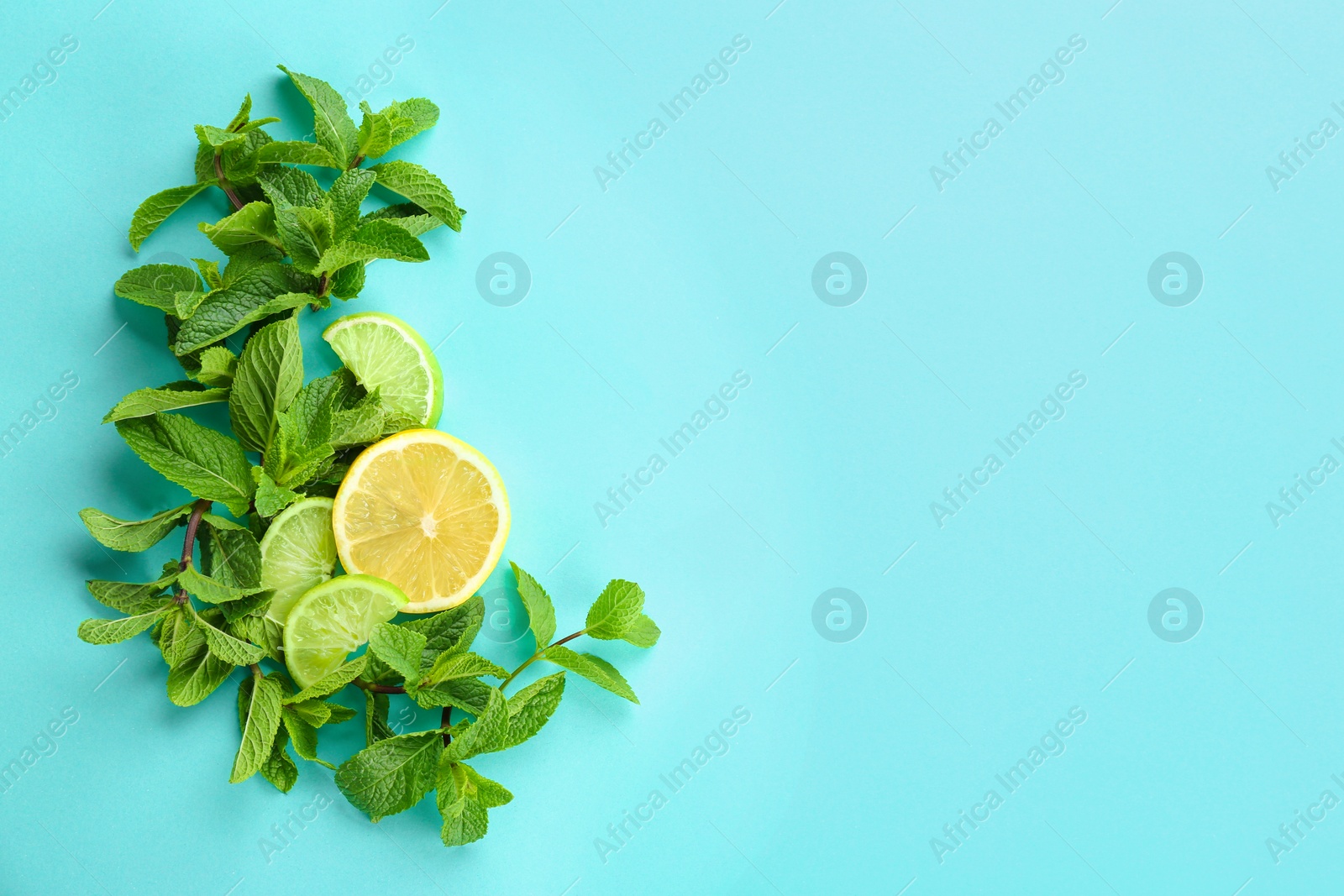 Photo of Fresh mint leaves and citrus fruit on color background, top view