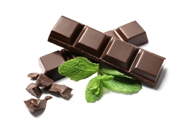 Photo of Pieces of dark chocolate with mint on white background