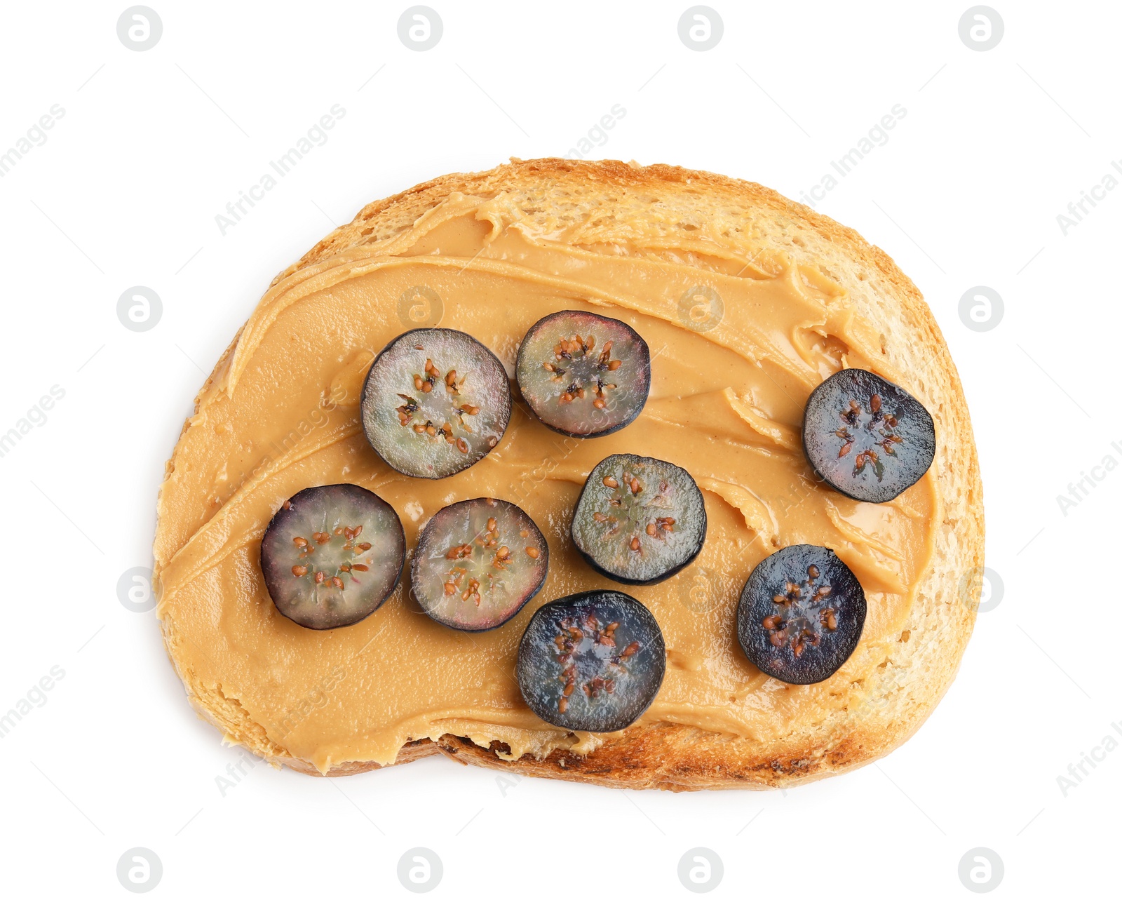 Photo of Slice of bread with peanut butter and blueberries on white background, top view