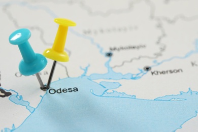 Photo of MYKOLAIV, UKRAINE - NOVEMBER 09, 2020: Odesa city marked with push pins on contour map of Ukraine, closeup