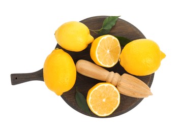 Wooden citrus reamer and fresh lemons on white background, top view