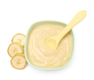 Photo of Tasty baby food in bowl, spoon and cut banana isolated on white, top view