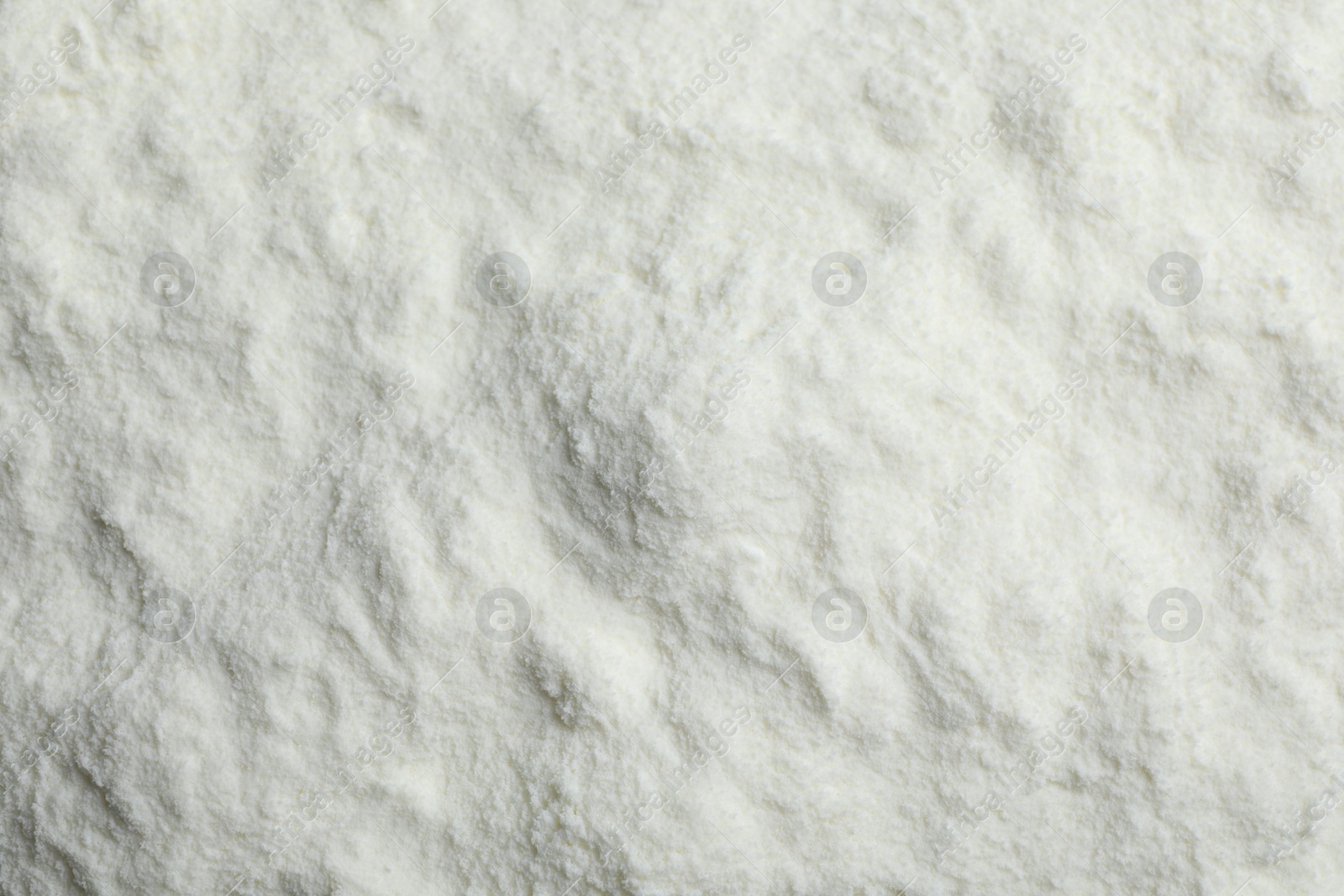 Photo of Top view of powdered infant formula as background. Baby milk