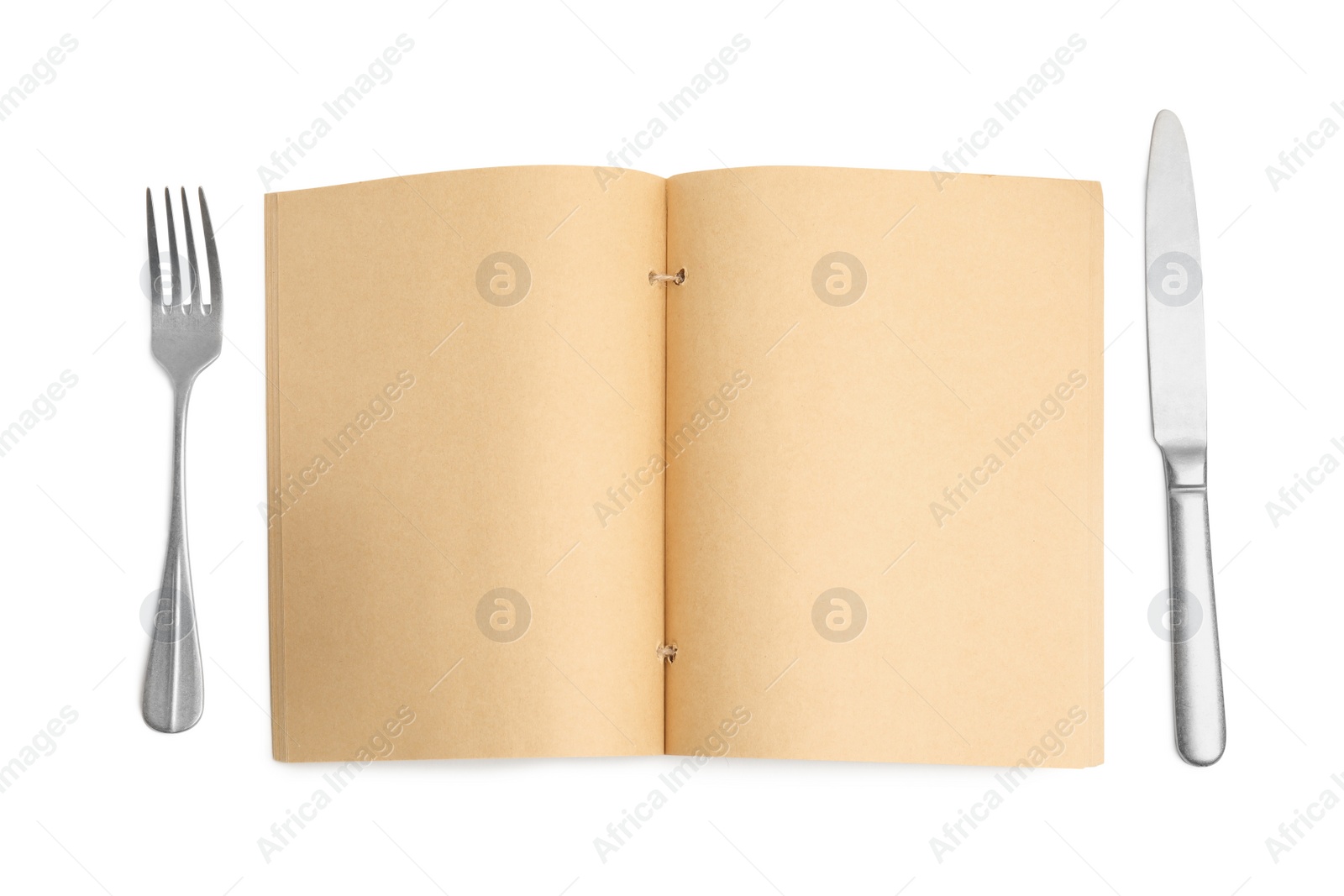 Photo of Blank recipe book and cutlery on white background, top view. Space for text