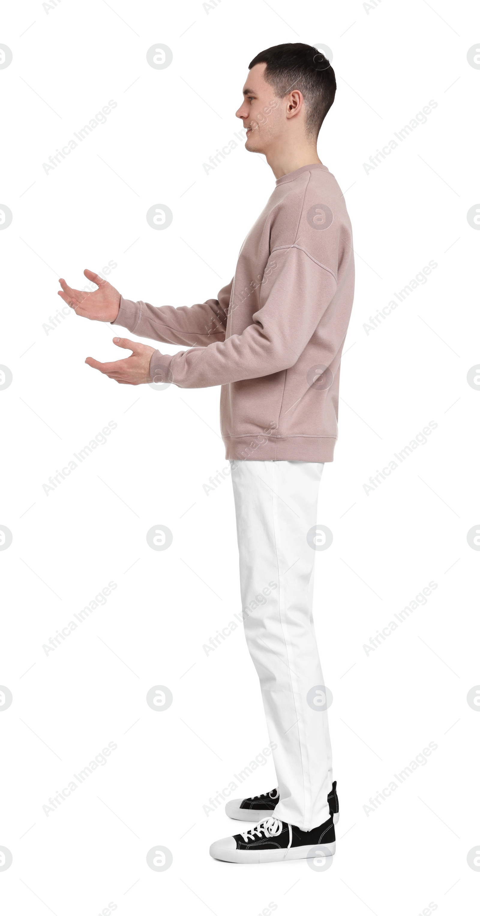 Photo of Full length portrait of handsome young man on white background