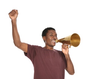 Young African-American man shouting into megaphone on white background