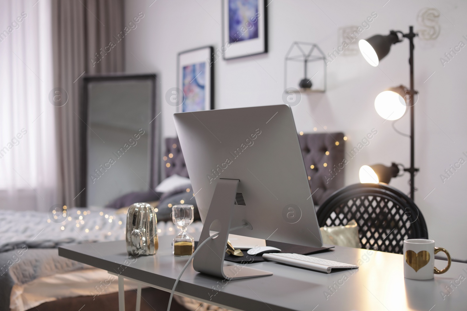 Photo of Stylish workplace interior with modern computer on desk