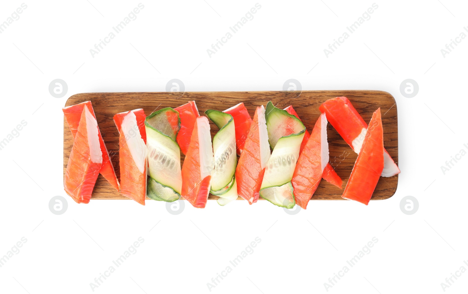 Photo of Wooden board with crab sticks and cucumber on white background, top view