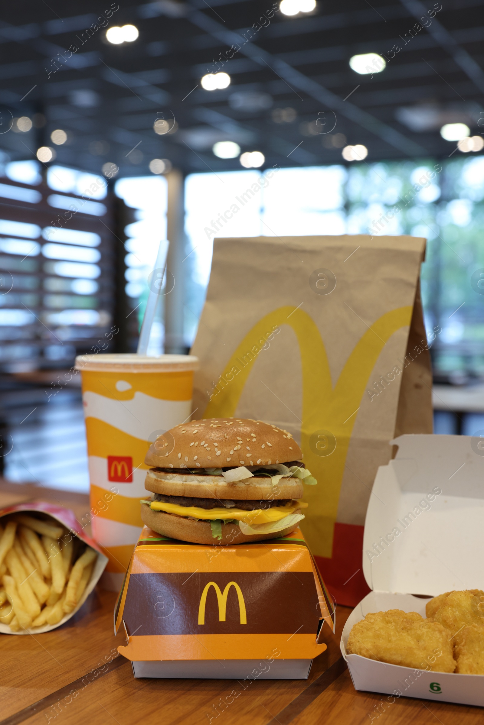 Photo of Lviv, Ukraine - October 9, 2023: McDonald's menu on wooden table in restaurant