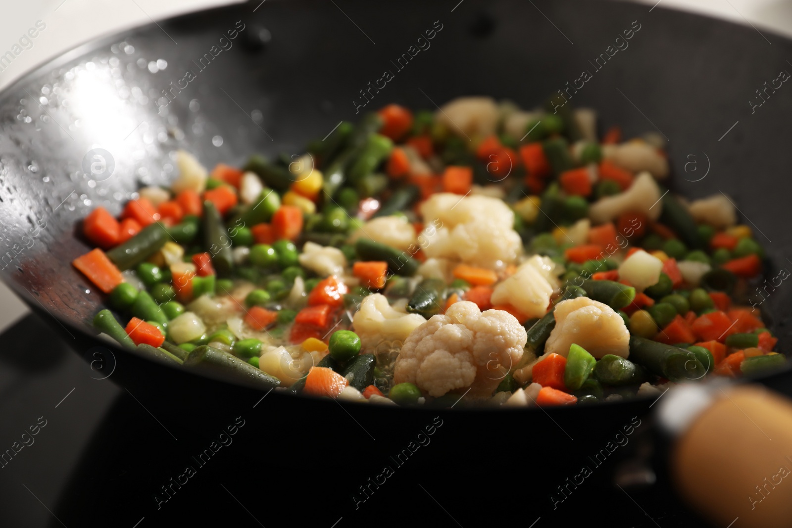 Photo of Frying pan with mix of fresh vegetables, closeup