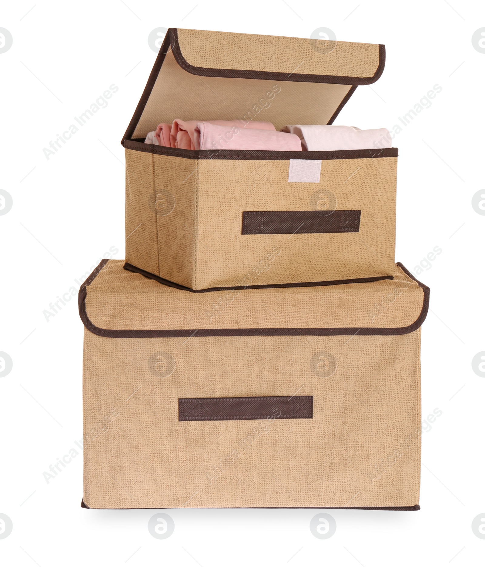 Photo of Textile storage cases with folded clothes on white background