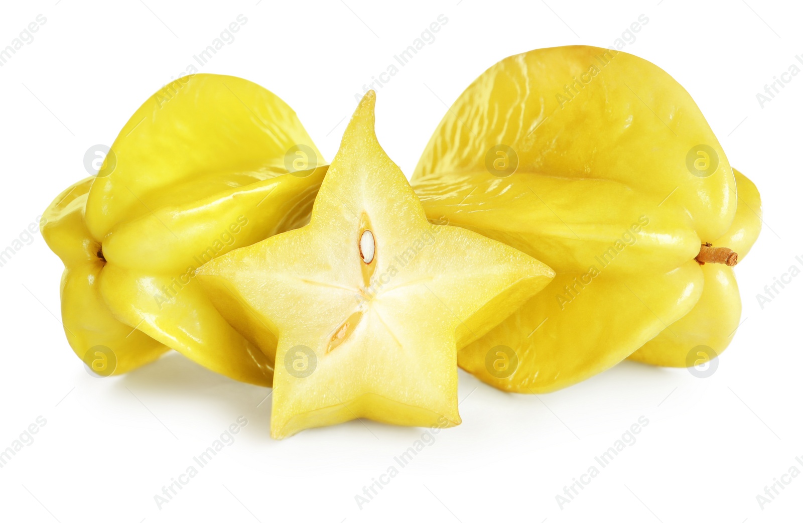 Photo of Cut and whole carambolas on white background