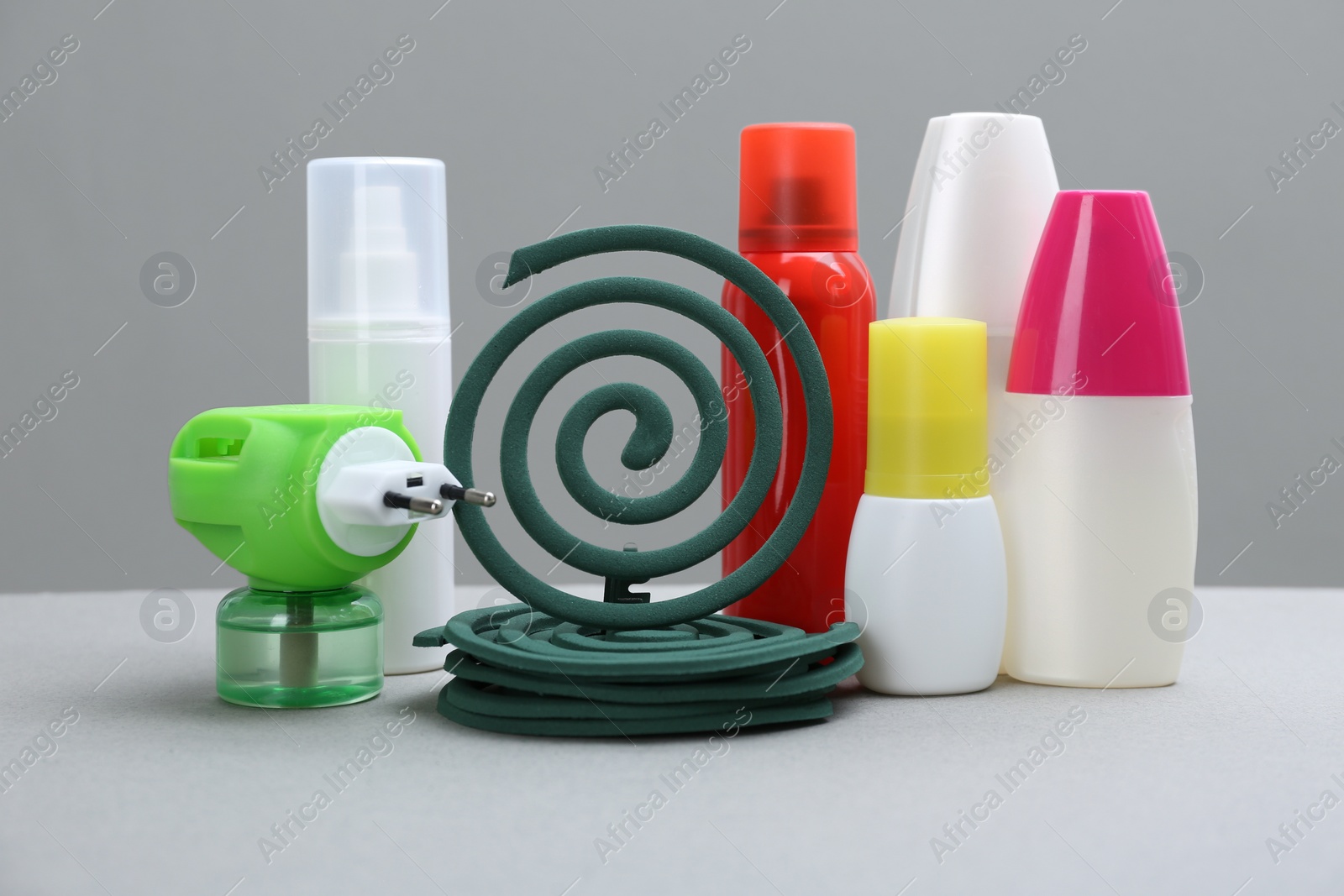 Photo of Set of different insect repellents on grey background