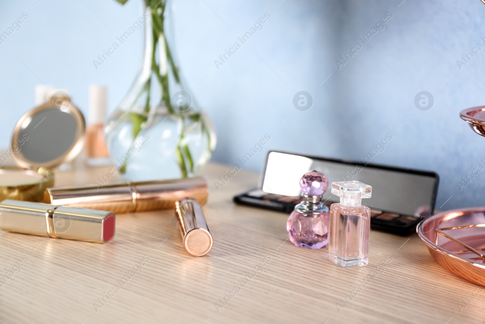 Photo of Set of luxury cosmetics on dressing table. Space for text