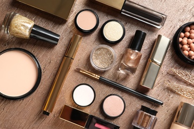 Photo of Set of luxury makeup products on color background, flat lay