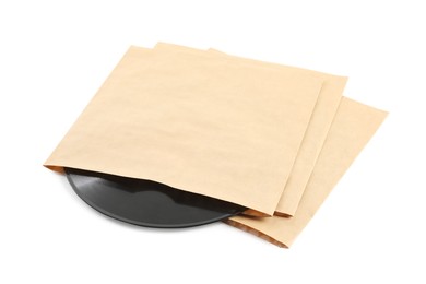Photo of Vintage vinyl records in paper covers on white background