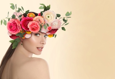 Image of Pretty woman wearing beautiful wreath made of flowers on beige background, space for text