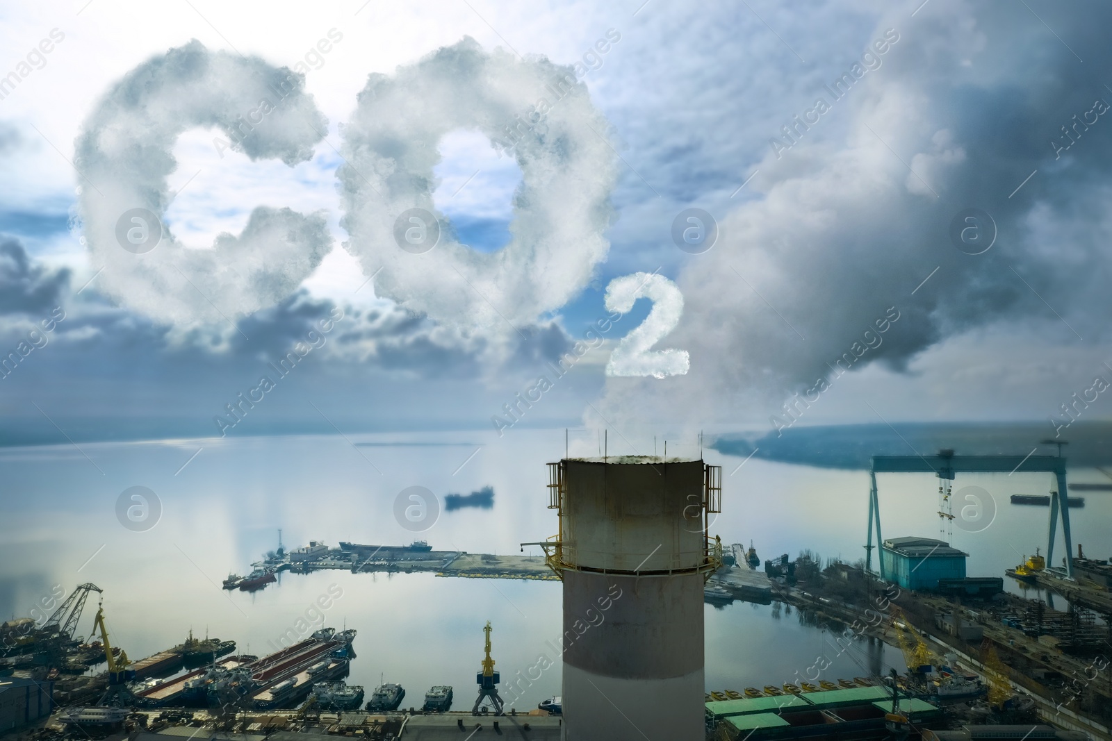 Image of Inscription CO2 made of smoke. Aerial view of industrial factory