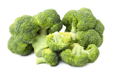 Photo of Pile of fresh raw green broccoli isolated on white