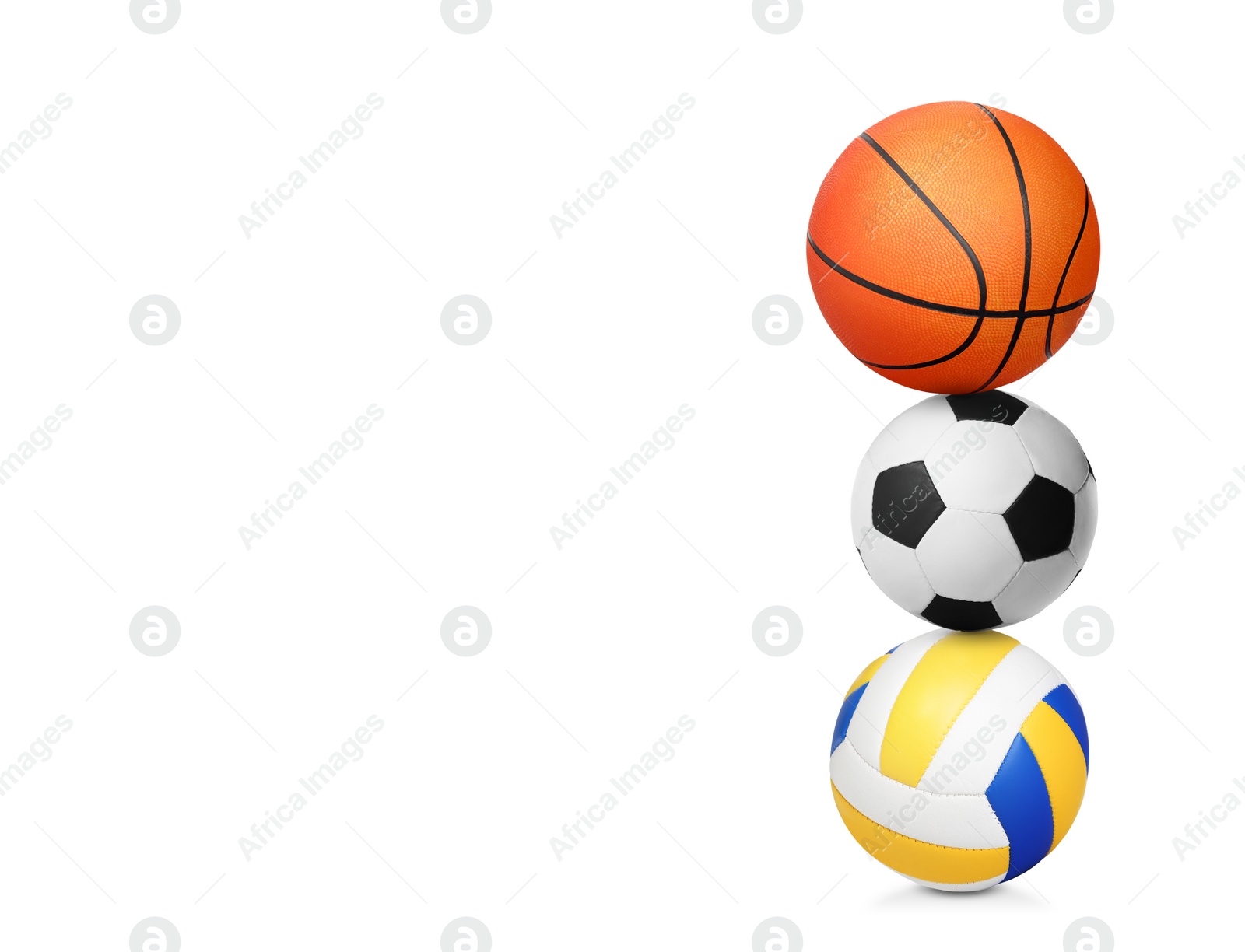 Image of Stack of different sport balls on white background