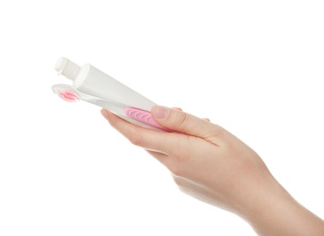 Photo of Woman holding toothbrush and paste against white background. Dental care