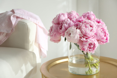 Bouquet of beautiful peonies on table indoors. Space for text