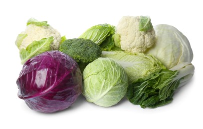 Many different fresh ripe cabbages on white background