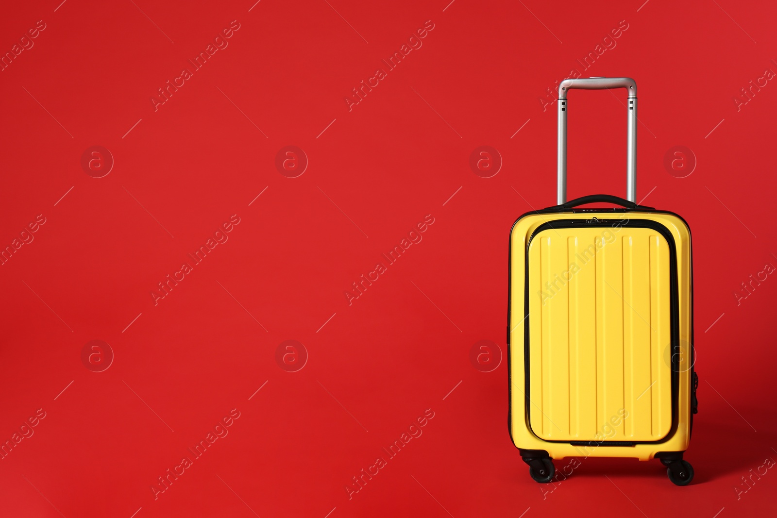 Photo of Stylish suitcase on color background. Space for text