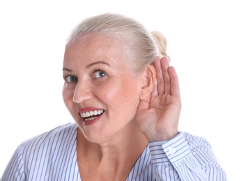 Mature woman with hearing problem on white background