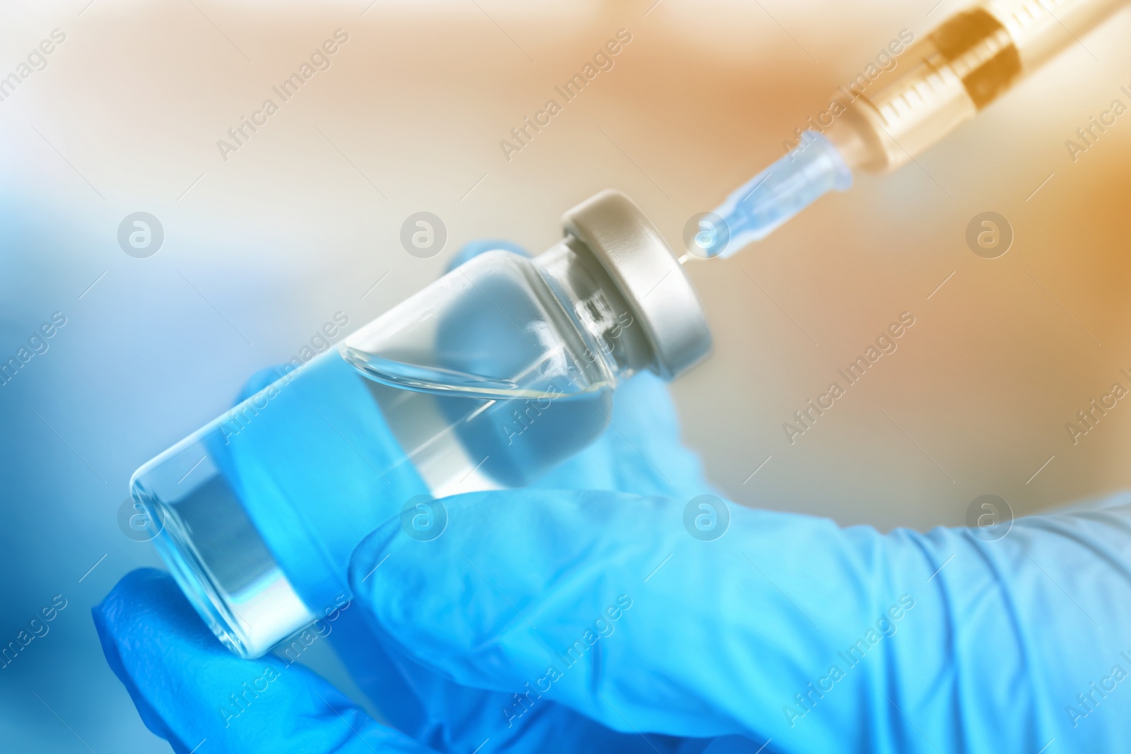 Image of Doctor filling syringe with medication, closeup. Vaccination and immunization